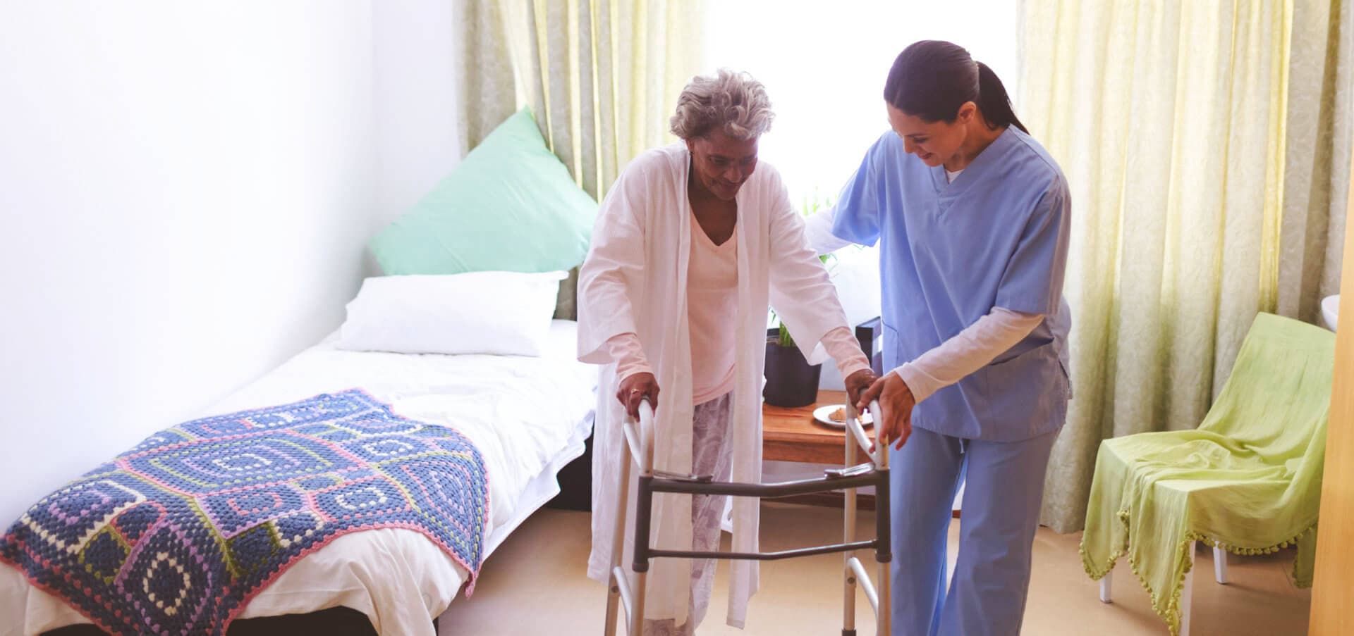 caregiver assisting senior woman
