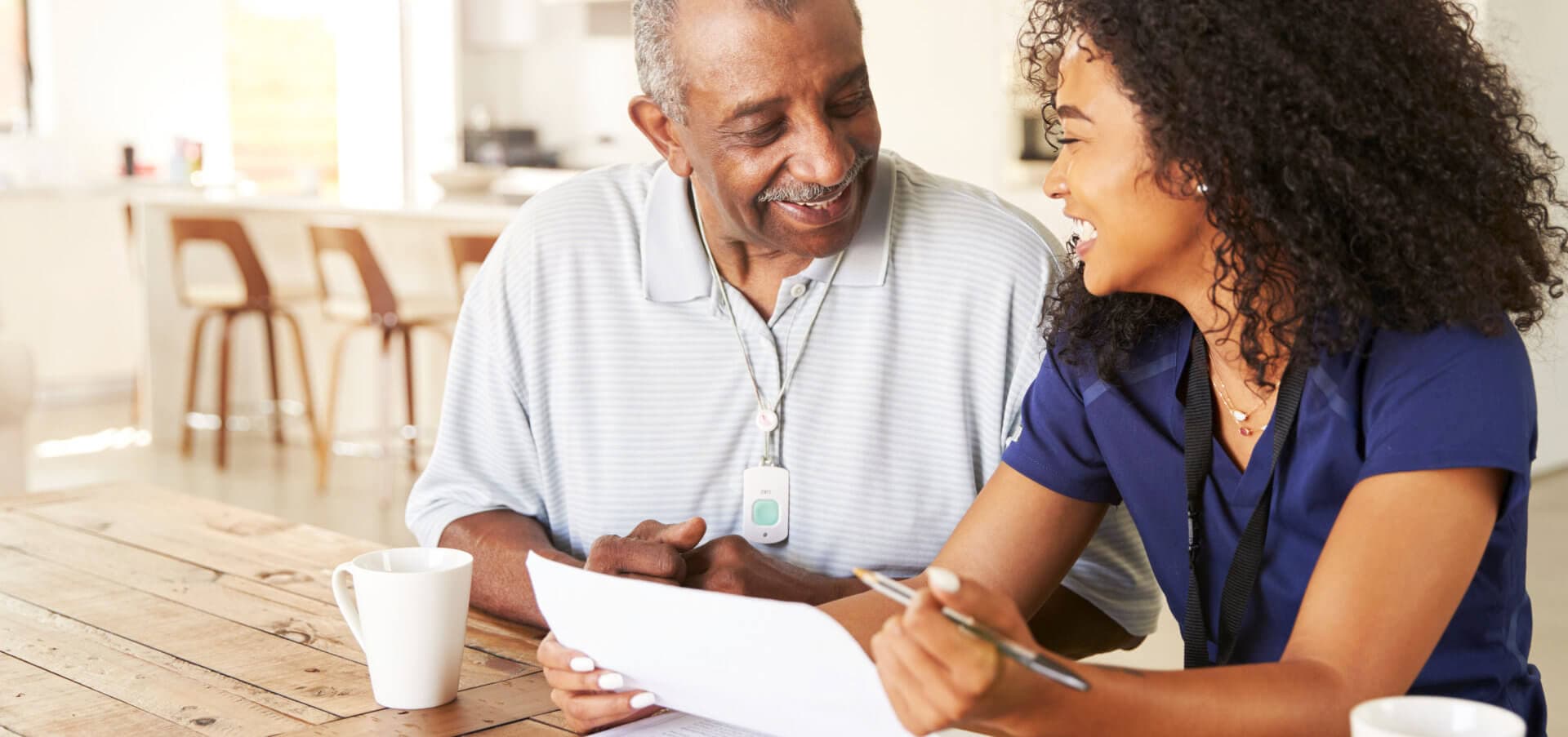 senior man and caregiver talking