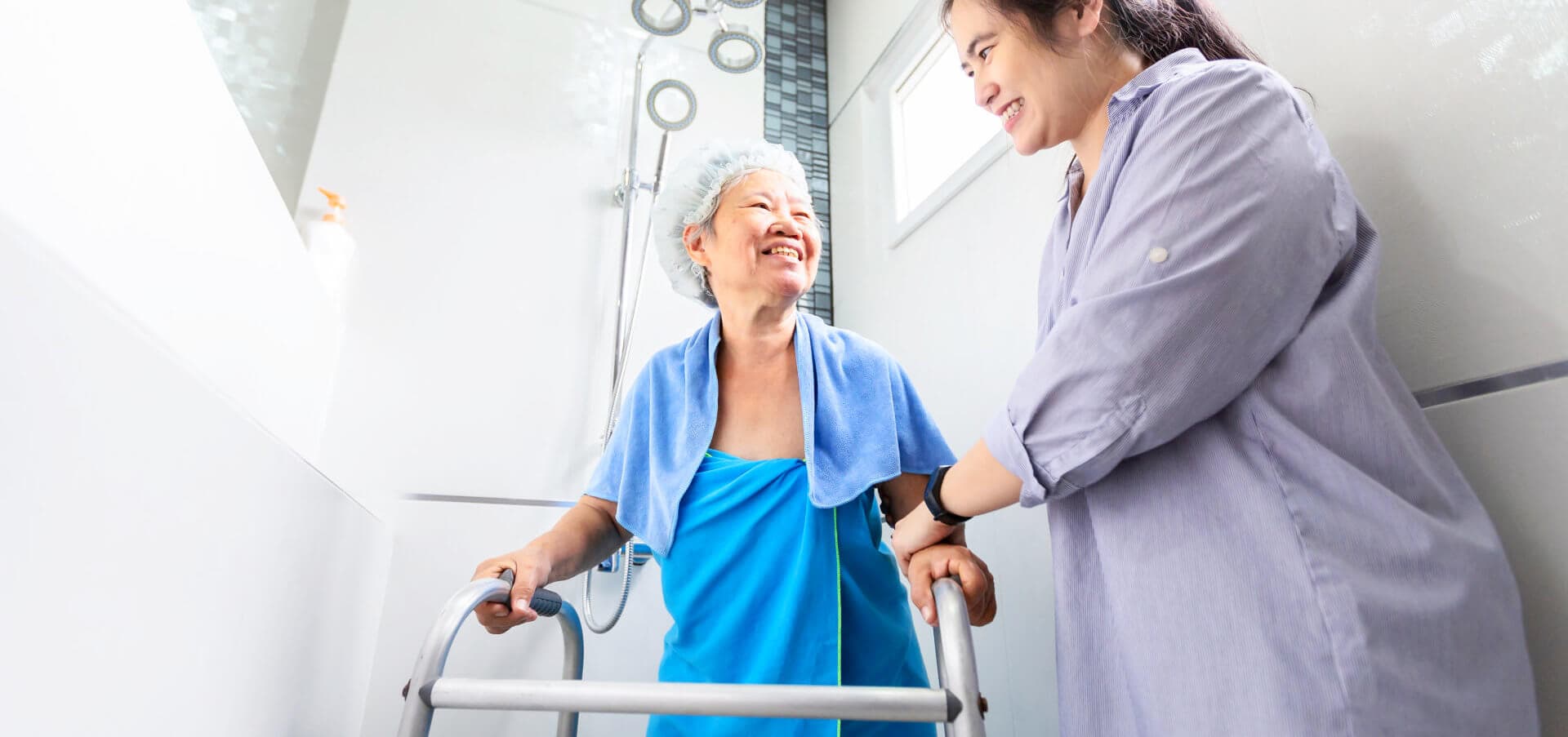 caregiver helping senior woman