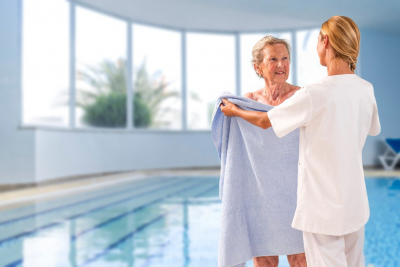 caregiver assisting senior woman