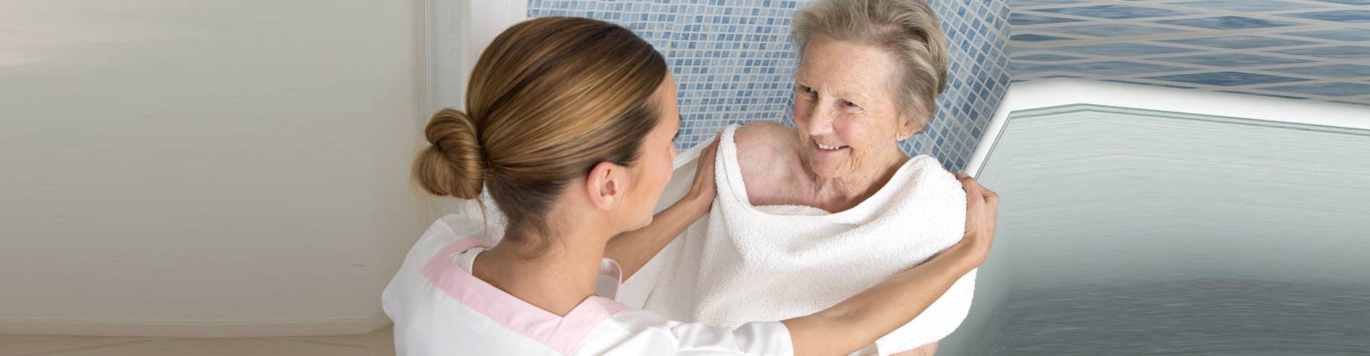 caregiver helping senior woman